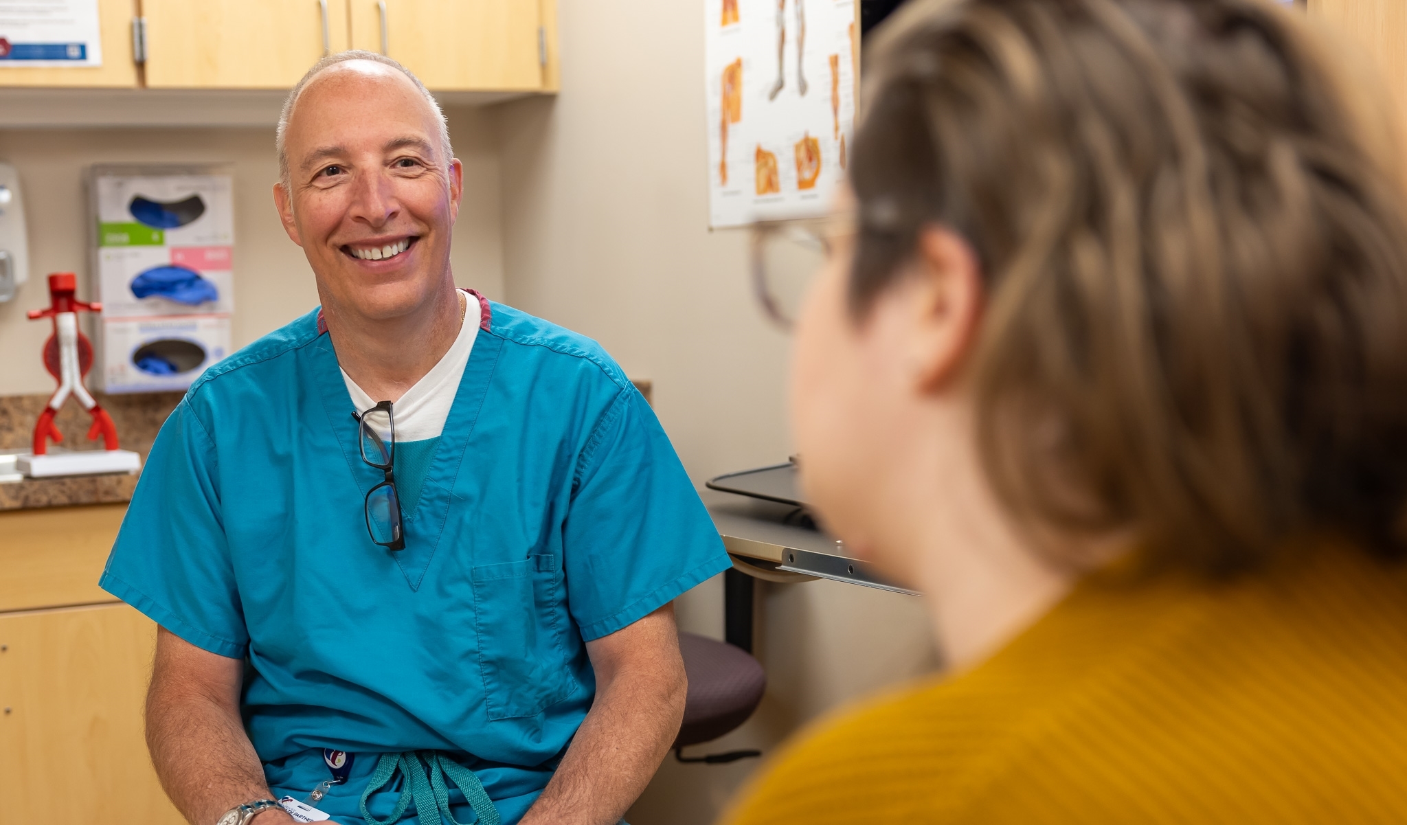 Physician listening to patient